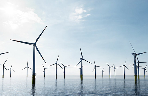 offshore wind turbines farm on the ocean