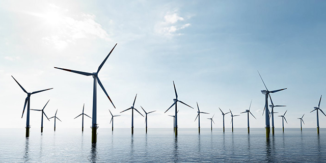 offshore wind turbines farm on the ocean